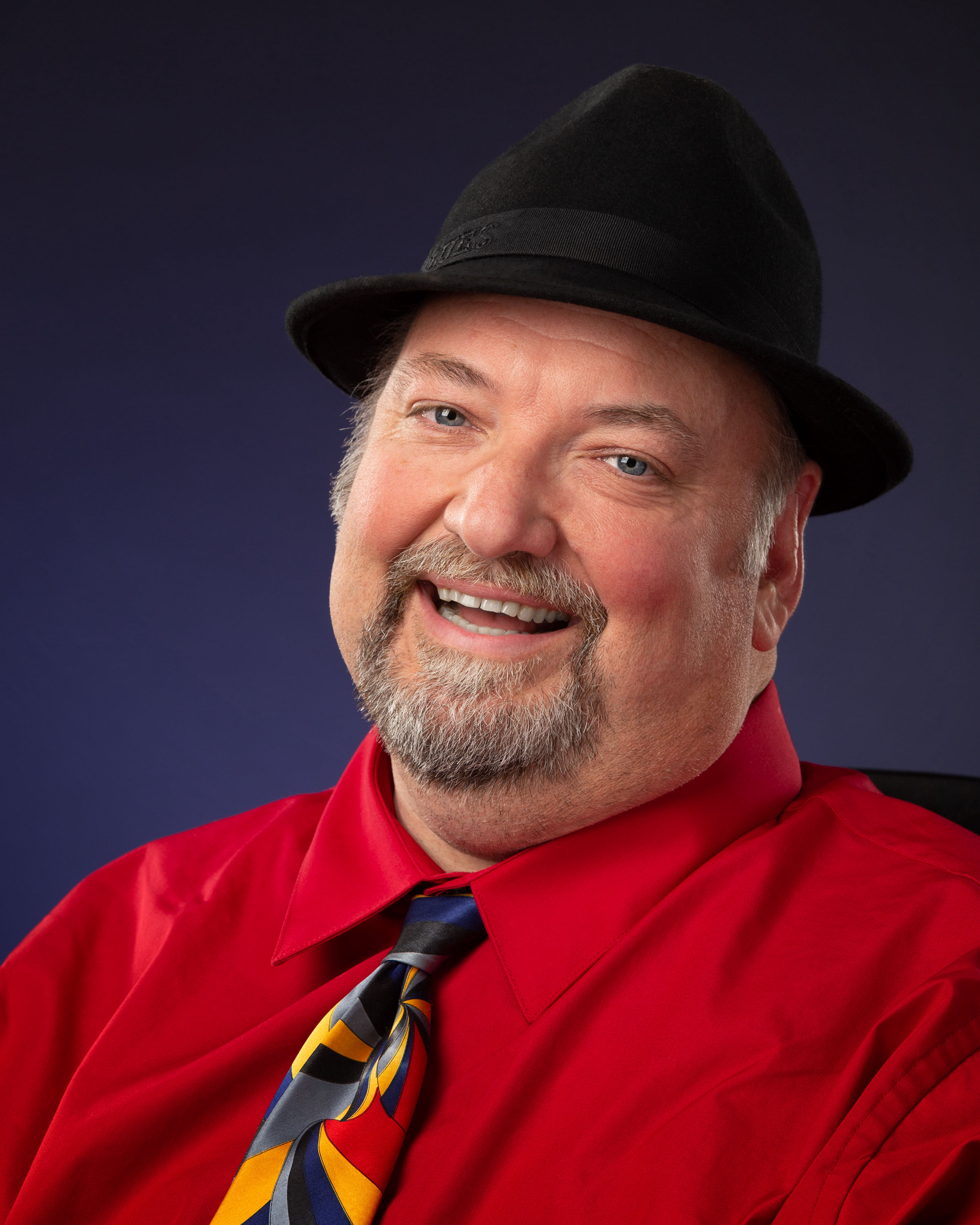 David Smiling with shirt, tie, and hat